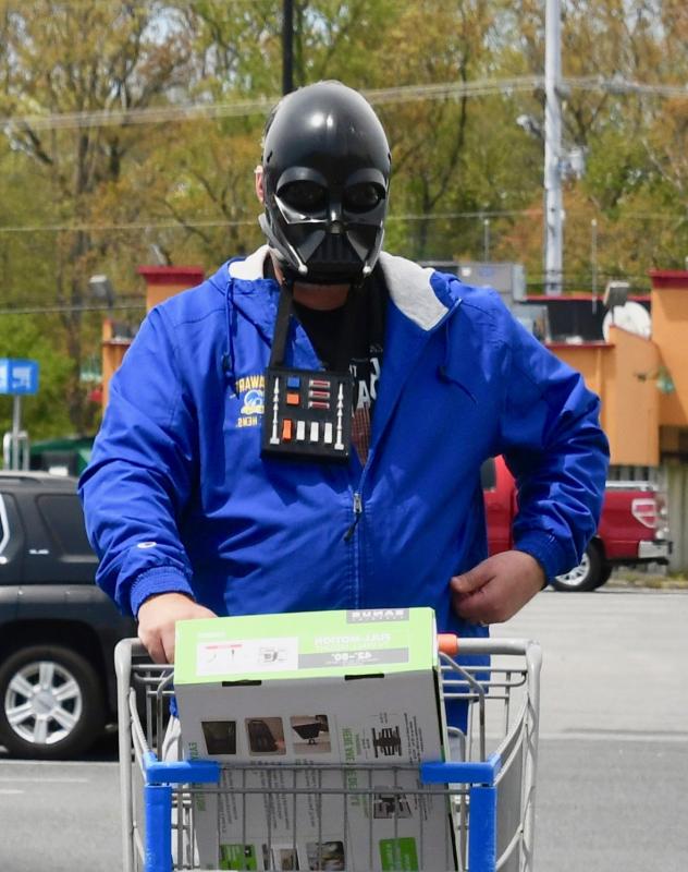 With mandatory face coverings required in stores, some people have resorted to creative masks like this shopper heading into the Rehoboth Walmart.